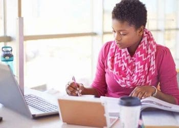 African woman working at computer