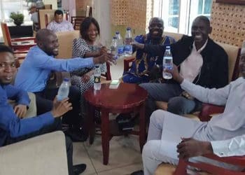 Script mentees discussing science news with SciDev.Net Training Coordinator Dr Charles Wendo and Radio Nigeria mentors