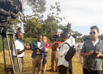 Journalists conducting interviews on a field trip