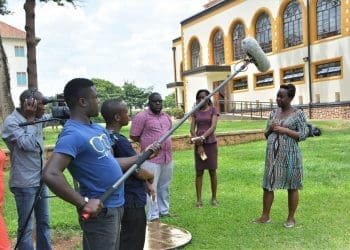 Journalists interviewing attendees at the Makerere Media Convention in Uganda.