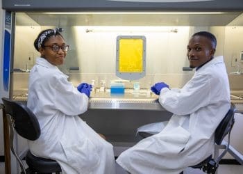 Image of two researchers in lab used for research communications webinar story