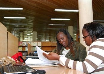 African women studying in a university library