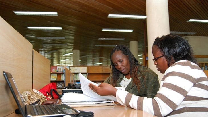 African women studying in a university library