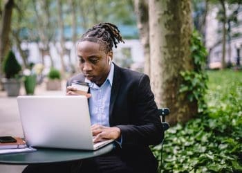 How to start a science blog - image of man working at computer in a garden